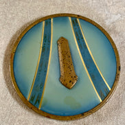 Close detail of pressed glass base pattern on Art Deco powder jar — circa 1925–1935