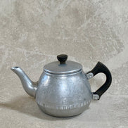 Lid and Bakelite finial of Carlton aluminum teapot, seated correctly — Swan Brand, Made in England, 1950s