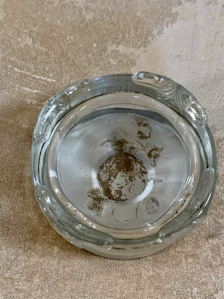 Lid removed showing interior of Art Deco pressed glass powder jar — clean interior, 1925–1935