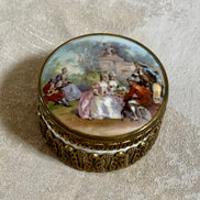 Watteau garden scene lid detail on German porcelain trinket box — six figures in court dress