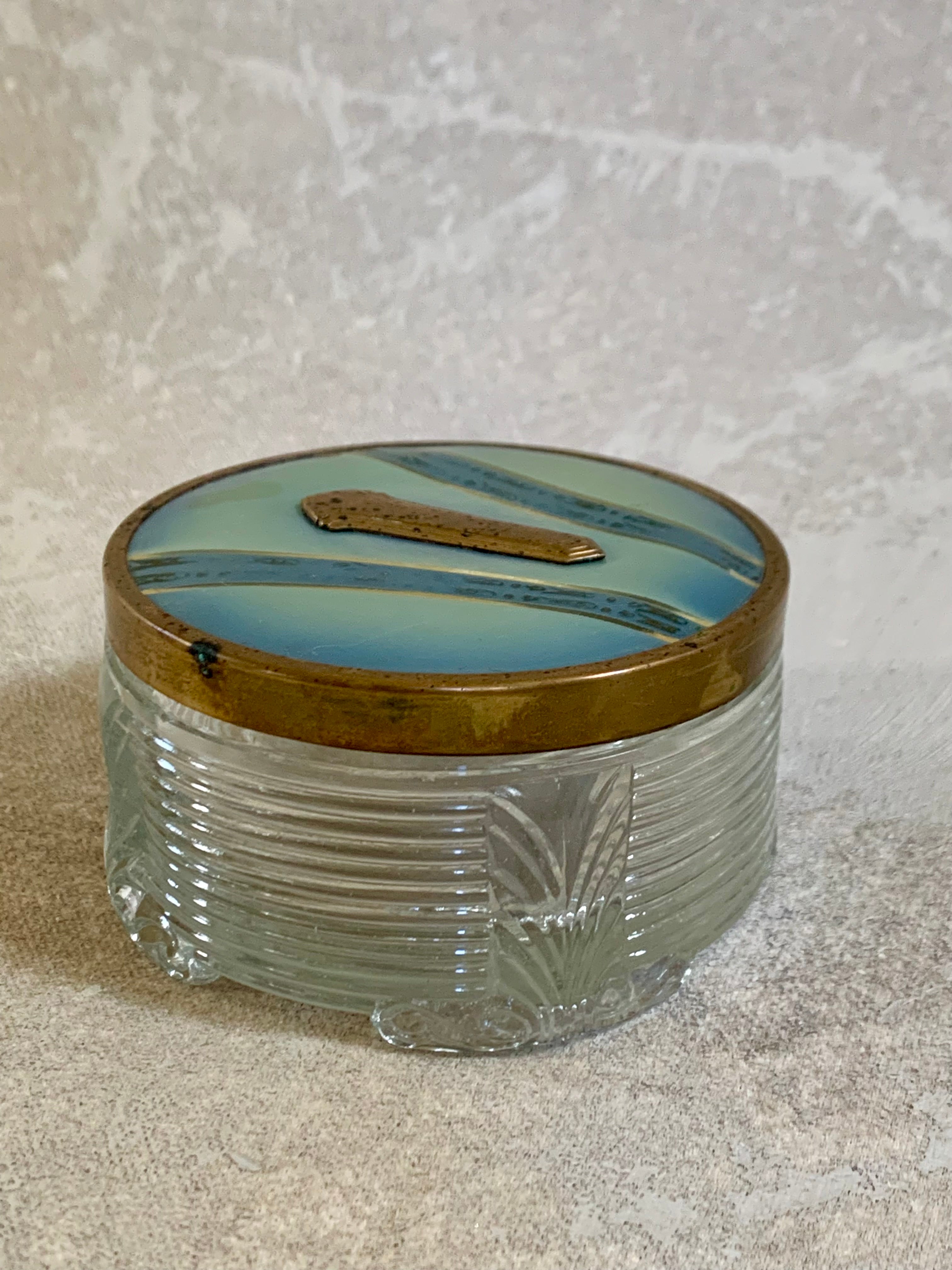 Gold stripe and gilt cartouche on powder blue enamel lid — Art Deco vanity jar detail