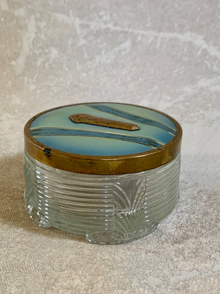 Gold stripe and gilt cartouche on powder blue enamel lid — Art Deco vanity jar detail