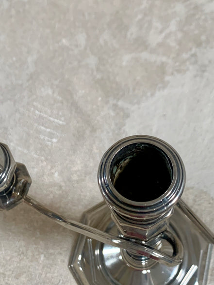 S-curve arm junction detail on silver plate candelabra — American silver plate, 1940s–1960s