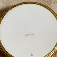 Surface craquelure detail on Watteau scene porcelain lid — century-old age lines, authentic