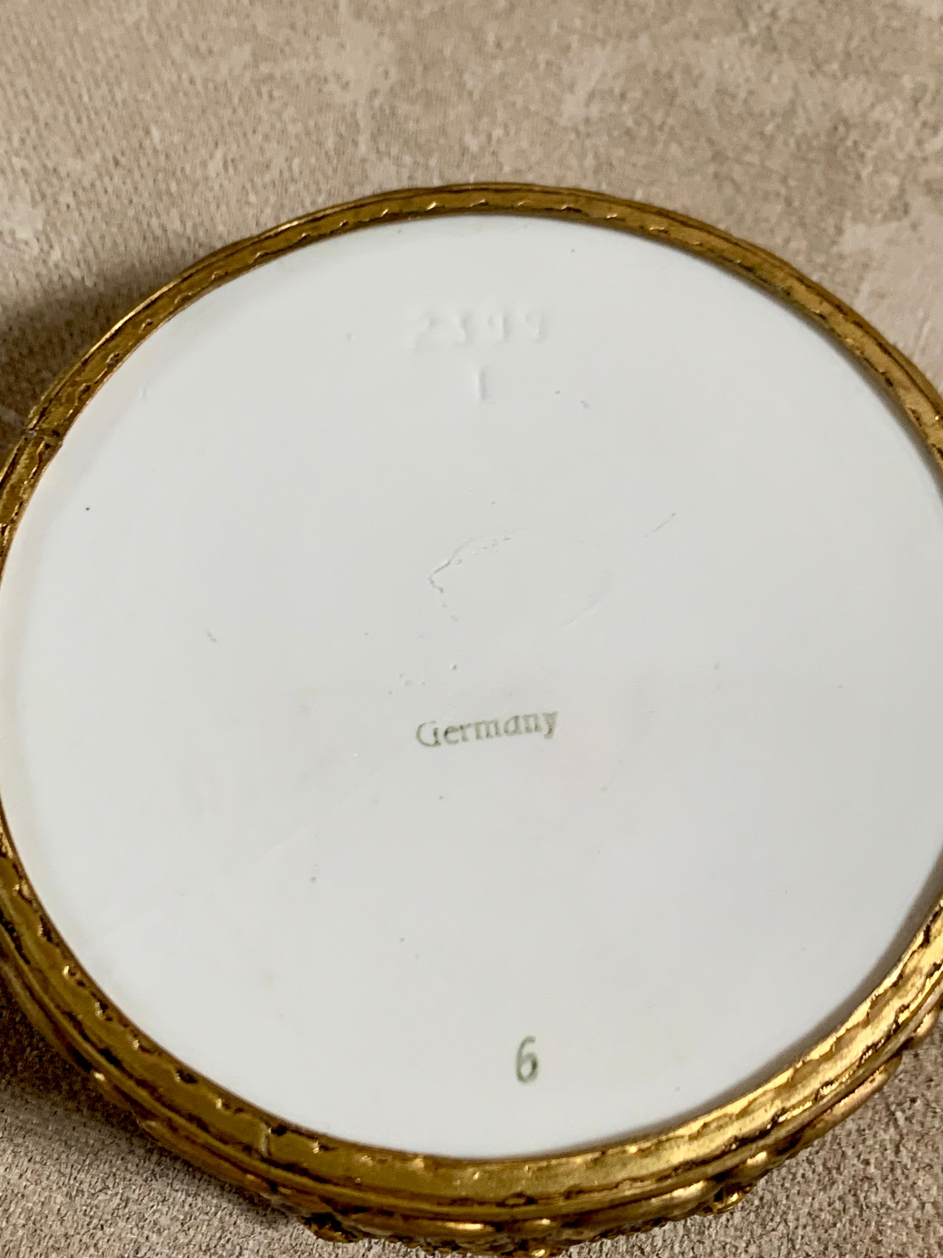 Surface craquelure detail on Watteau scene porcelain lid — century-old age lines, authentic