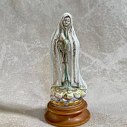 Full height view of Our Lady of Fatima ceramic figurine on wood base — Gilded Estate, Jolene Le Mille
