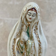 Front view of Our Lady of Fatima figurine showing blue-green robe and prayer hands — Jalisco Mexico