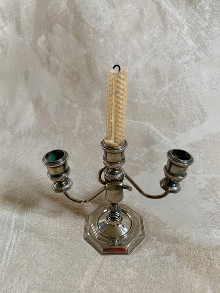 Three-quarter view of silver plate candelabra showing full height and base — Mid-Century