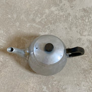 Spout and upper body of Swan Brand Carlton teapot showing pebbled hammered finish below engraving — Cromalin ware, 1950s