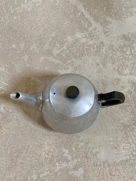 Spout and upper body of Swan Brand Carlton teapot showing pebbled hammered finish below engraving — Cromalin ware, 1950s