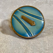 Art Deco pressed glass powder jar with powder blue enamel lid — circa 1925–1935 vanity piece
