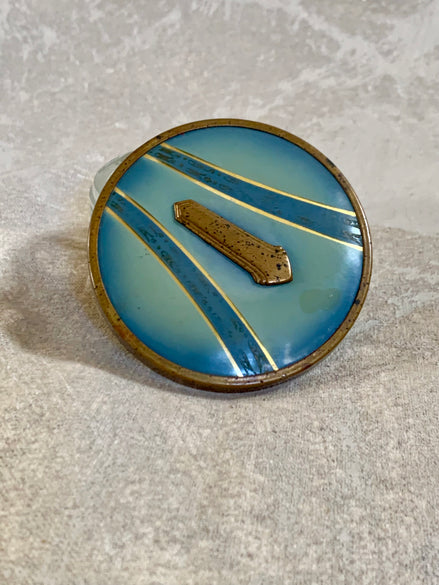 Art Deco pressed glass powder jar with powder blue enamel lid — circa 1925–1935 vanity piece