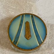 Full view of Art Deco powder jar with blue enamel and gold lid — circa 1925–1935 boudoir decor