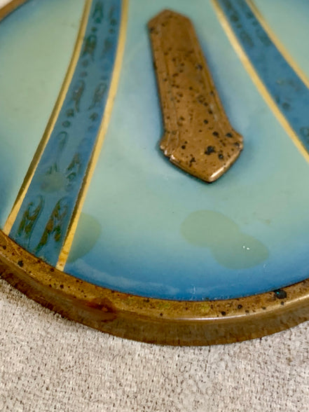 Three-quarter view of Art Deco powder jar with blue and gold lid — Jolene Le Mille Archive