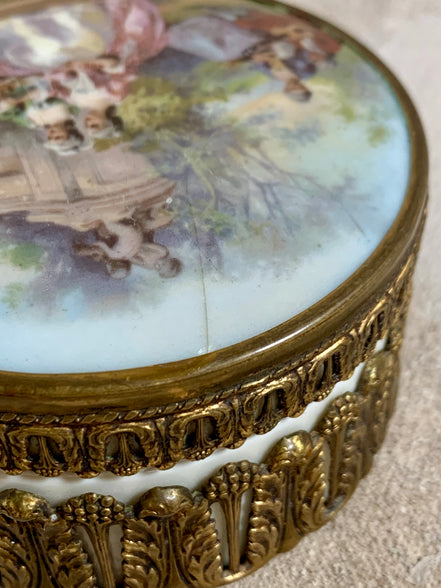 Interior of antique German porcelain trinket box — clean white bisque, ormolu mounts intact