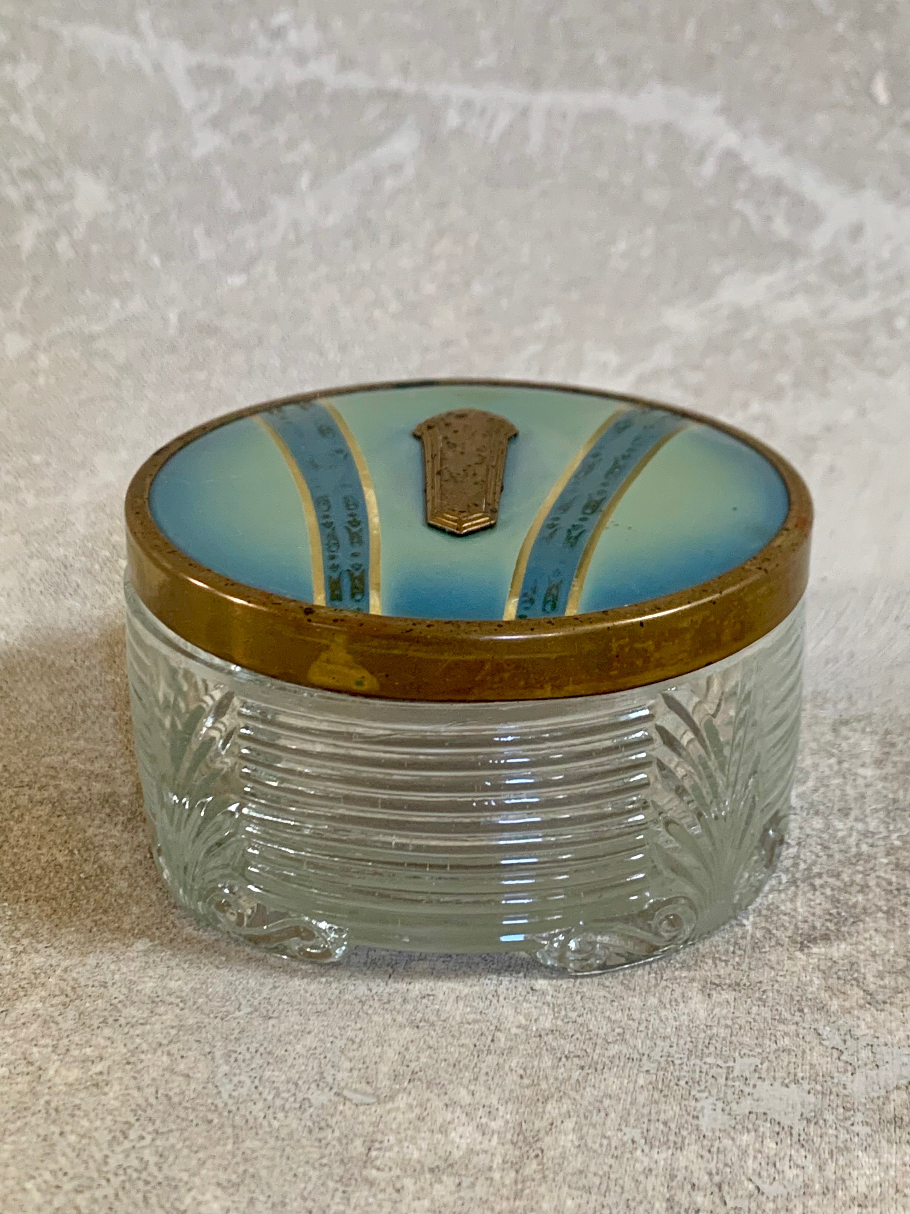 Side profile of Art Deco pressed glass powder jar — blue enamel lid, gold decoration, 1925–1935