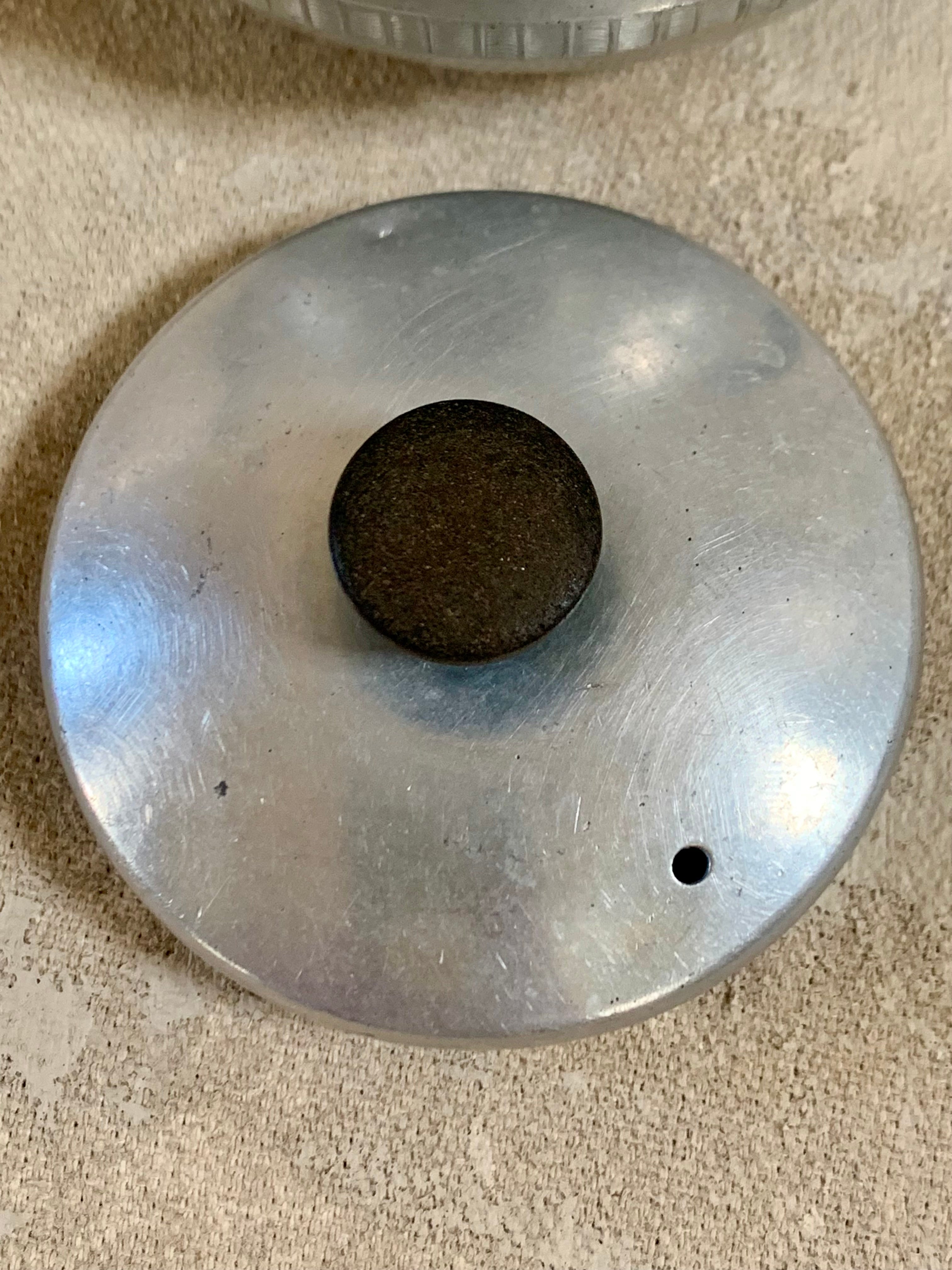 Interior of Carlton aluminum teapot showing tannin patina from decades of honest use — 1940s–1950s