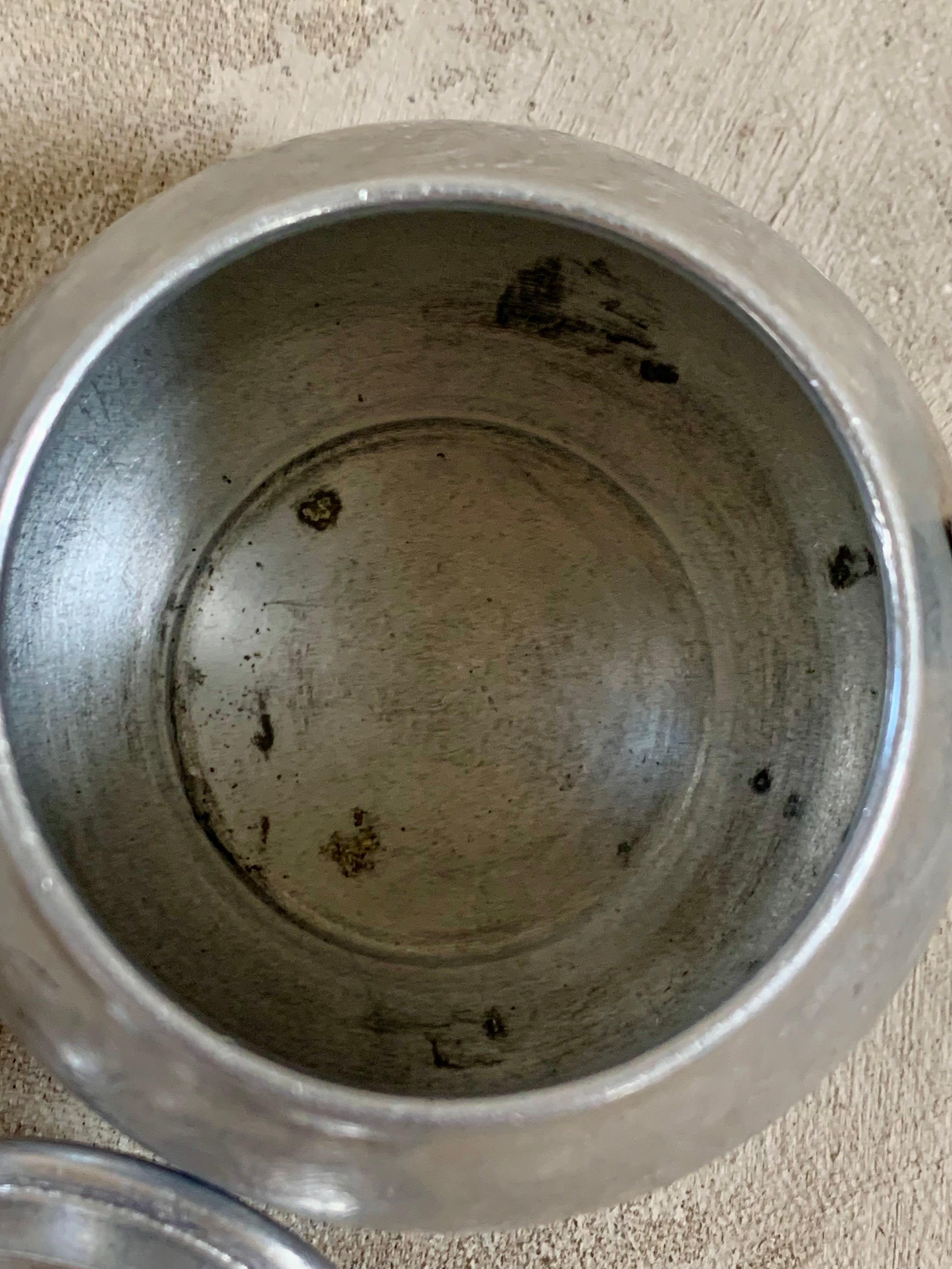 Overhead view of Swan Brand Carlton 2-cup teapot lid and body — etched floral aluminum, Made in England