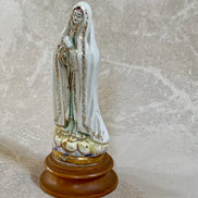 Close detail of crackle glaze on ceramic Our Lady of Fatima — authentic Jalisco earthenware patina