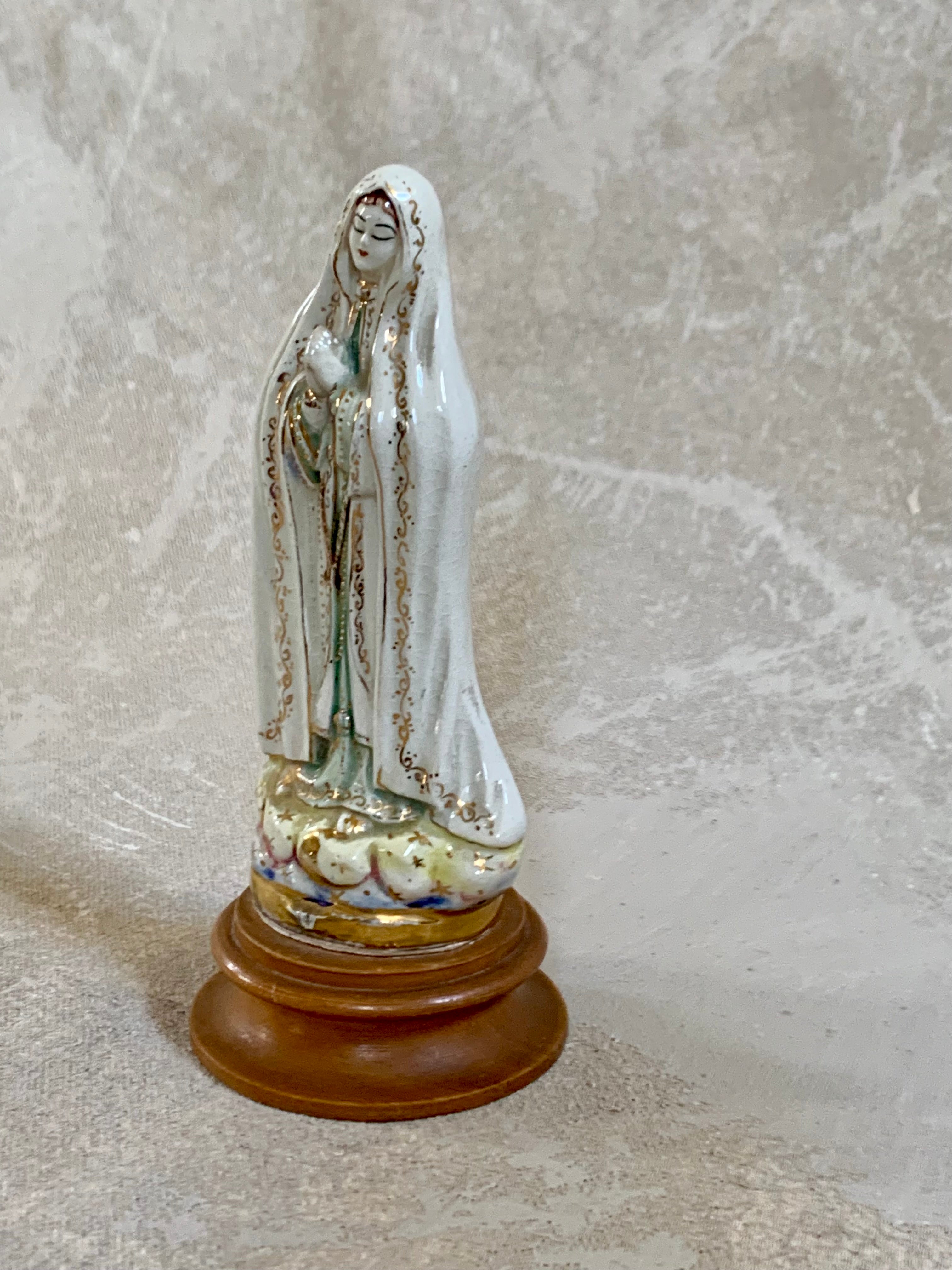 Close detail of crackle glaze on ceramic Our Lady of Fatima — authentic Jalisco earthenware patina