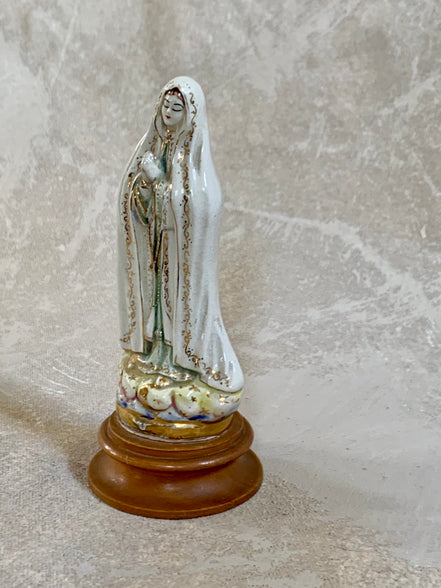 Close detail of crackle glaze on ceramic Our Lady of Fatima — authentic Jalisco earthenware patina