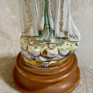 Mantle and veil detail of ceramic Fatima figurine showing crackle glaze pattern — Mexico