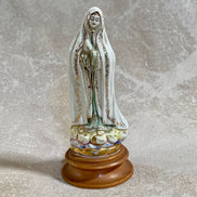 Gold stars and cobalt wash on cloud base of Fatima figurine — Jalisco earthenware, 1950s