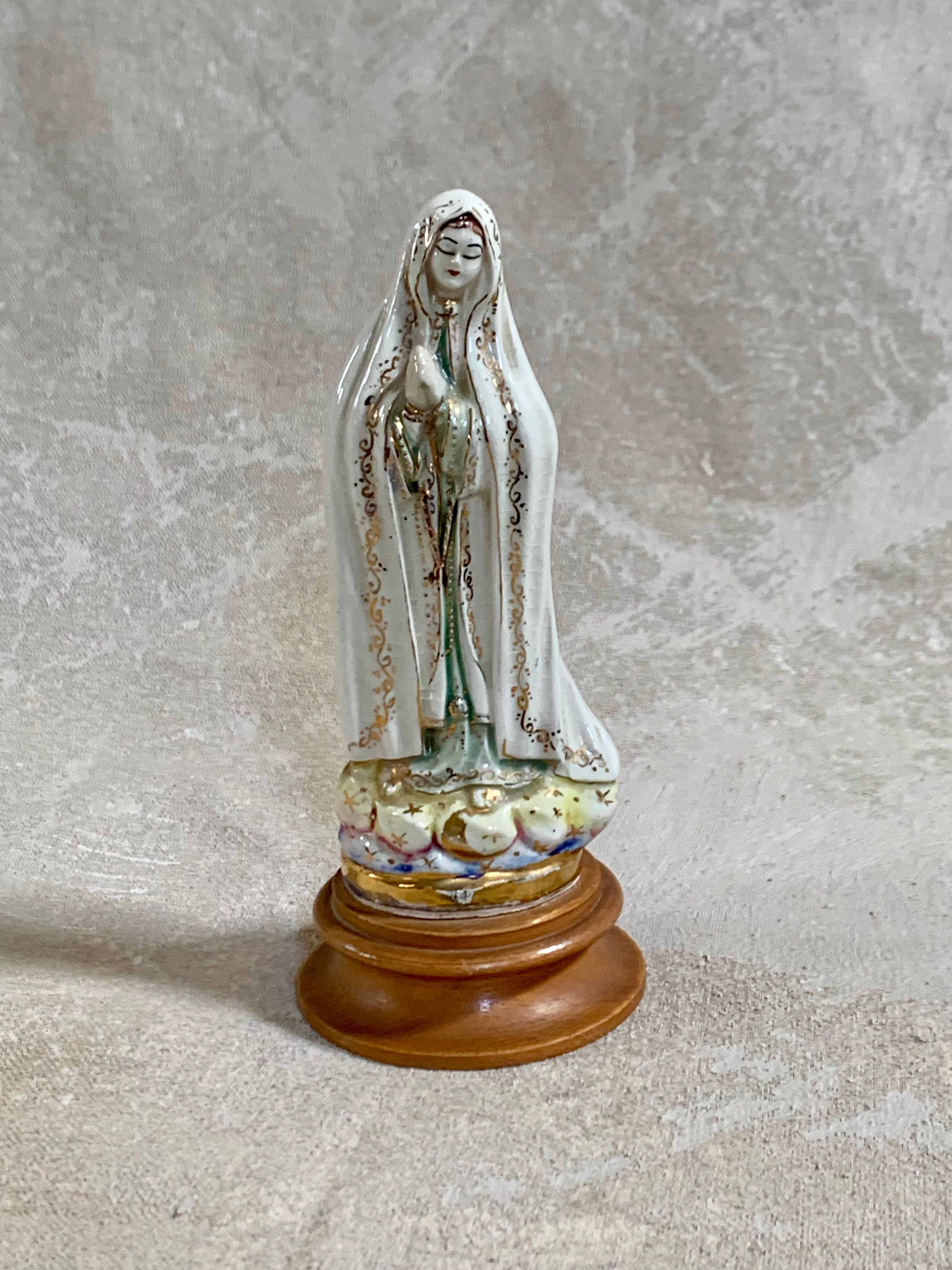 Gold stars and cobalt wash on cloud base of Fatima figurine — Jalisco earthenware, 1950s