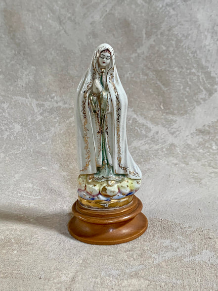 Gold stars and cobalt wash on cloud base of Fatima figurine — Jalisco earthenware, 1950s